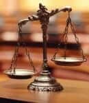 Close up of scales of justice in a court room