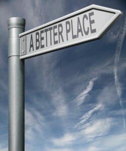 Road sign stating, "A Better Place," with storm raging behind it.