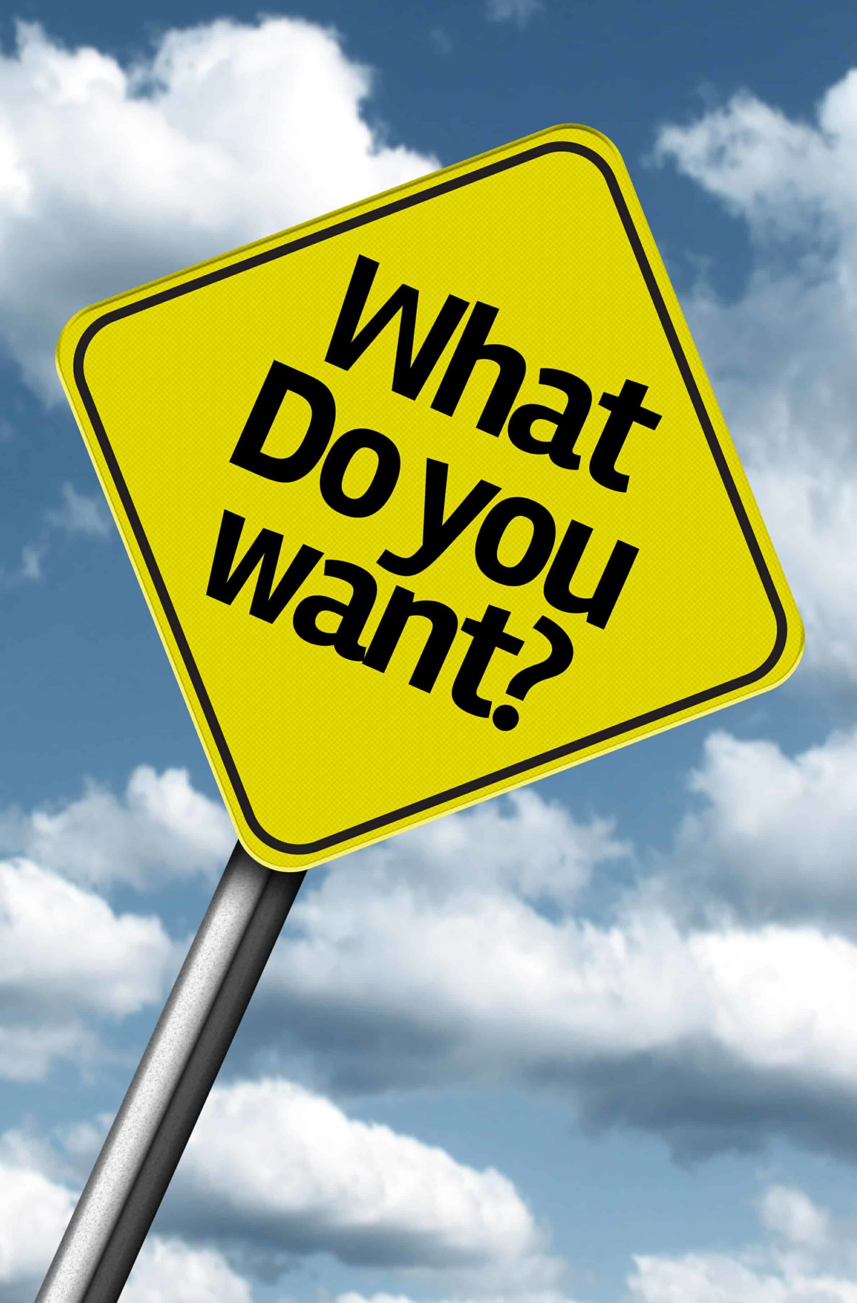 Yellow Road sign saying "What do You want?"