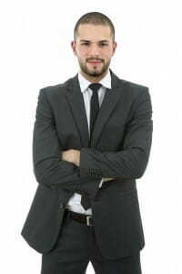 Confident young man in a suit and tie dressed for court