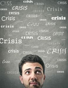 Man with word "Crisis" written many times around him needs divorce tips.