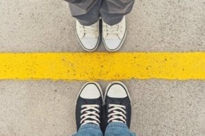 Sneakers at yellow line - Divorce tip: set boundaries with your spouse
