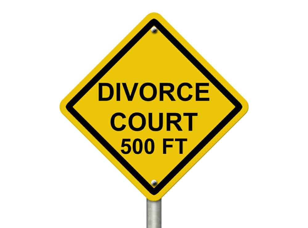 Yellow sign saying, "Divorce Court 500 Ft"