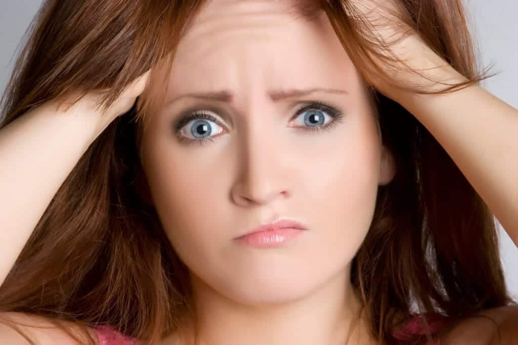 Close up of confused young woman thinking about divorce