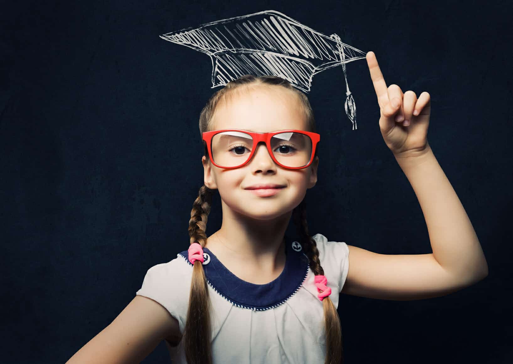Smart young girl with glasses and a graduation cap: educate yourself