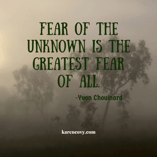 Fog covered forest with saying, "Fear of the unknown is the greatest fear of all."