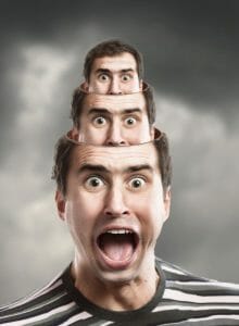 Screaming man with smaller heads coming out of his head.