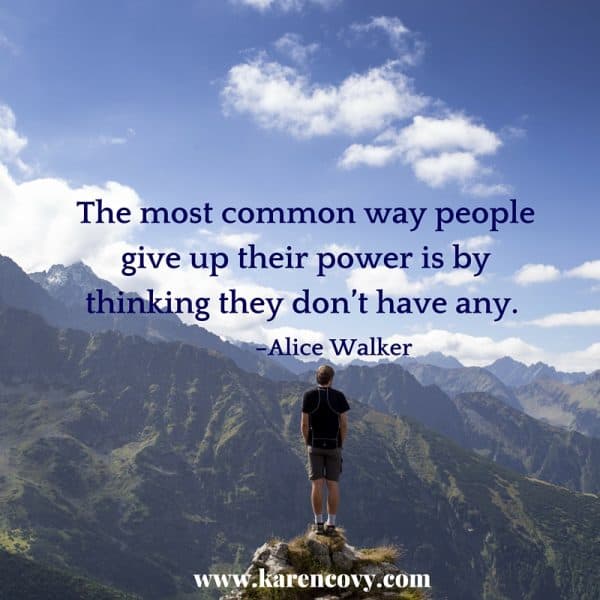 Man looking out at mountains with quote: The most common way people give up their power is by thinking they don't have any.