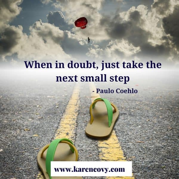 Picture of empty sandals on a road with quote: When in doubt just take the next small step.