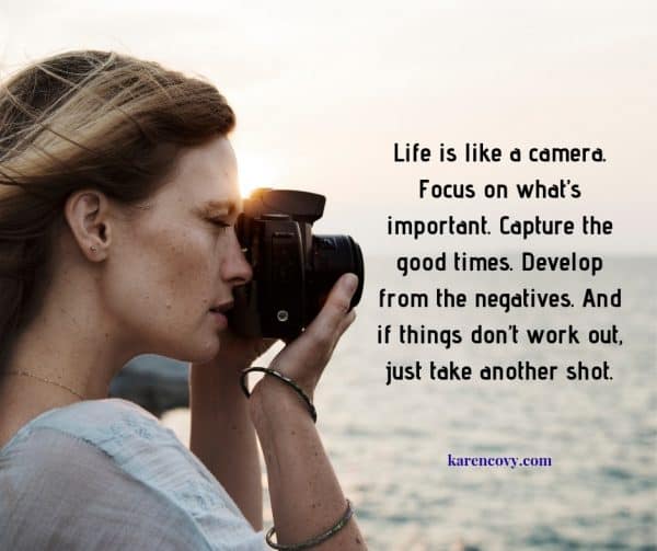 Woman looking thorugh a camera at the sea with saying: Life is like a camera. Focus on what's important.