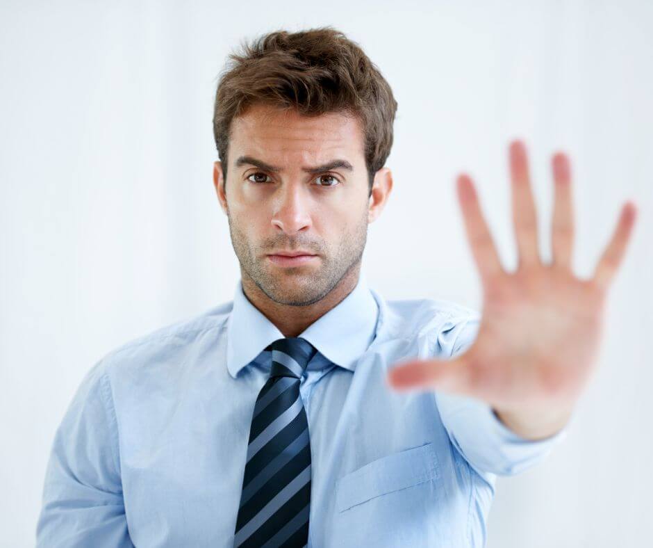Man with his hand out, indicating "Stop! Don't cross my relationship boundaires!"