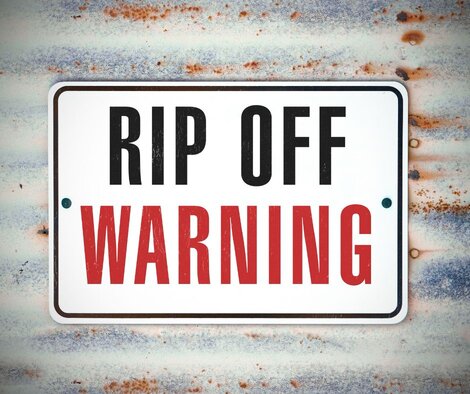 Sign in big black and red letters that says "Rip Off Warning"