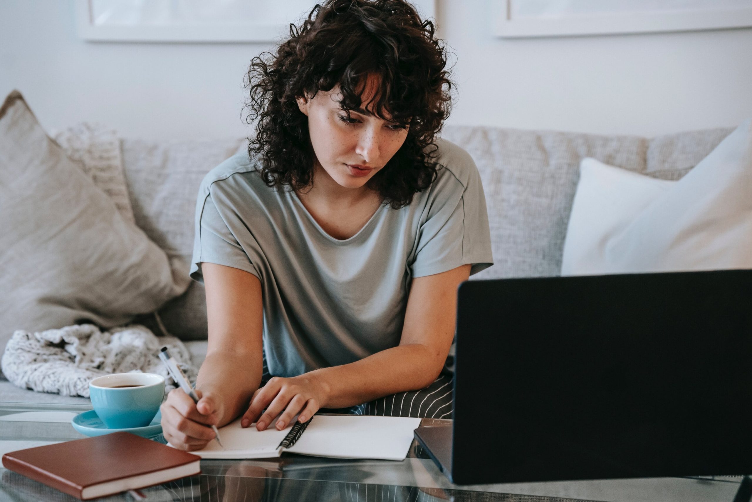 Beautiful woman at a laptop trying to sell jewelry online