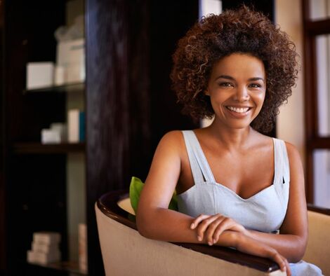 Beautiful smiling African American woman looking at the camera.