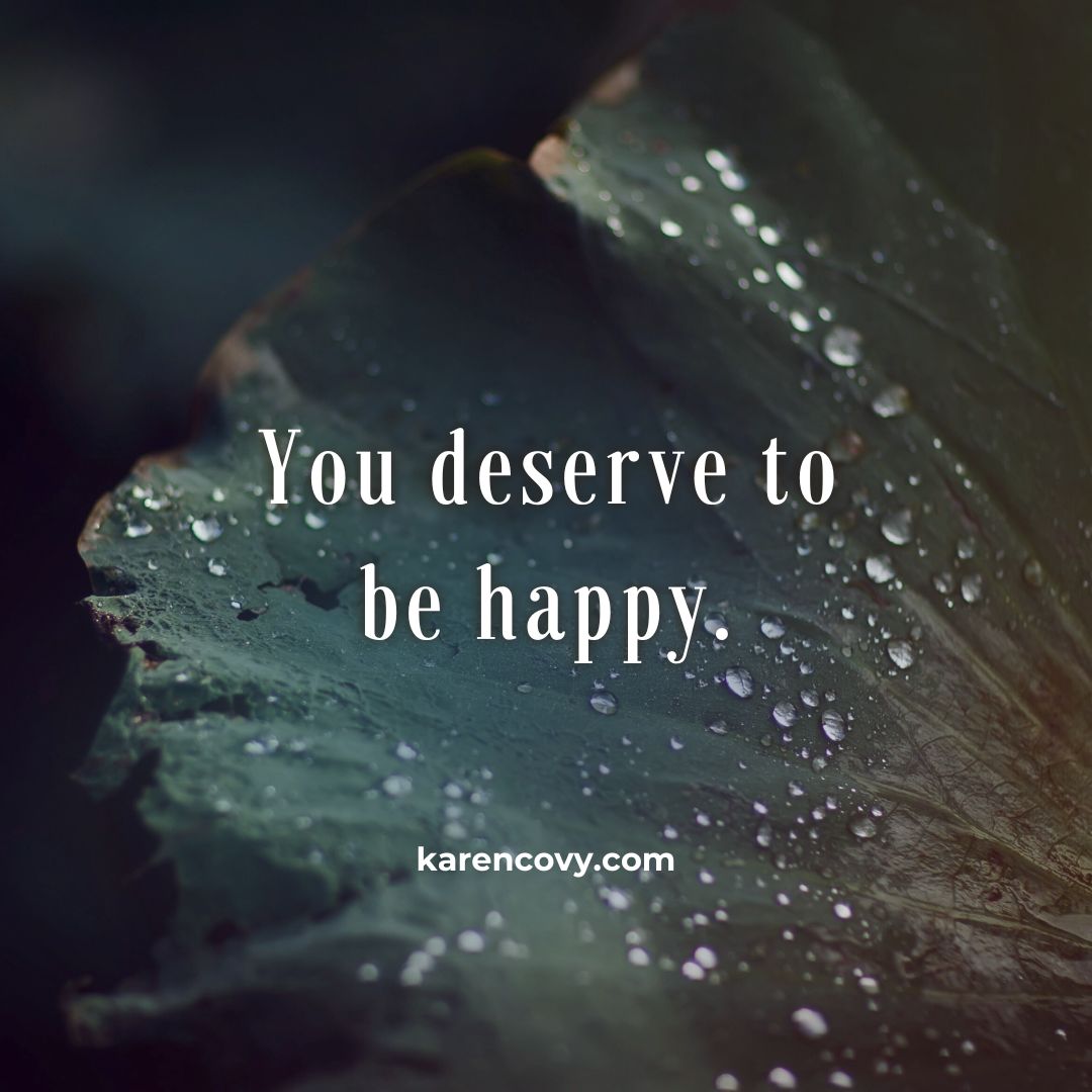 Closeup of the inside of an oyster shell with the quote: You deserve to be happy.