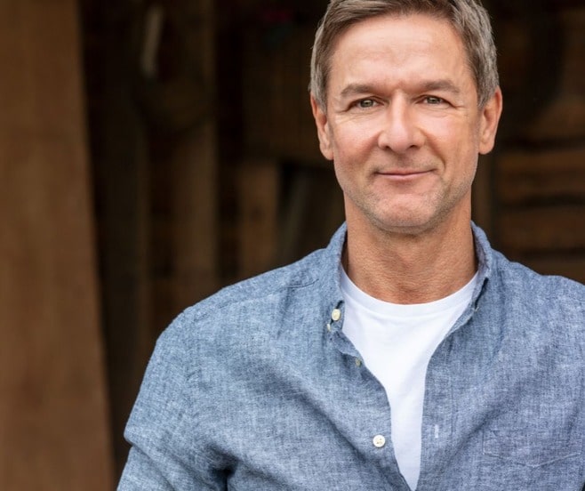 Middle aged man who looks like a farmer.