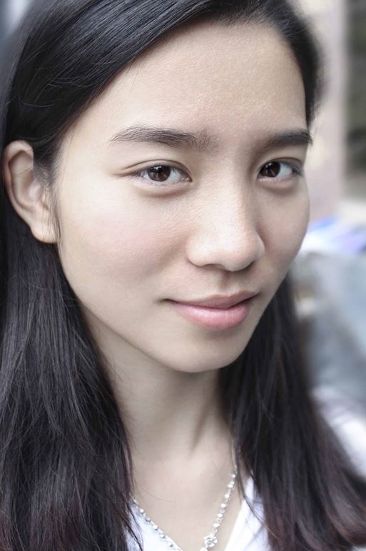 Young Asian woman looking at camera