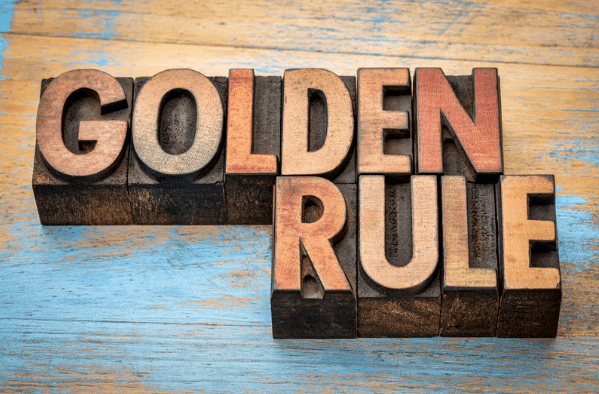 The words "Golden Rule" carved in a wood block.