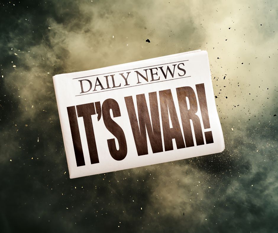 News headline saying "It's War" over background of an ex[plosion.
